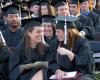 Katie Daniel and Cassie Harris enjoy a laugh during the spring 2007 graduation ceremony. - Photo by Morris Abernathy