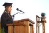Senior class president Karie Thomas presents the class gift during spring graduation ceremonies. The Class of 2007 will purchase benches for the Great Lawn and also donate money for a project designed to supply clean water to African villages.  - Photo by Matthew Diggs