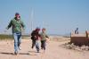 Junior Biology Major Hunter Stepp runs with two boys on the 2007 Engineering GO trip to North Africa. - Photo by Uncredited