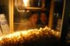 Crystal Kinser and Merry Hindman enjoy some popcorn at the 2006 Howdy Party. - Photo by Heather Phillips