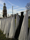 The September 11 memorial environmental installation created by the art department included 6000 white plastic sheets representing the victims along with 19 black plastic sheets representing the terrorists. - Photo by Cam Tracy