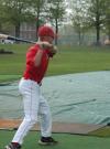 Graduate assistant coach David Canary his fungos during pre-game batting practice. - Photo by Steven Aldridge