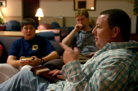 Josh Turner and Kent Willis listen as Nick Bateman talks with Rising Seniors during a Worship Night held in the McAfee Commons.