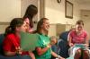 Molly Merck, Chelse Lampley and Jessica Pikowski laugh as they and other Rising Senior students discuss a plan of survival test. - Photo by Stephanie Schroeder