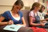 Rising Seniors Sarah Lechman and Rachel Moore complete a personality test and survival strategy. - Photo by Stephanie Schroeder