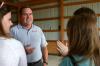 Keith Absher, dean of the McAfee school of business administration, talks with Rising Seniors during a cookout dinner. - Photo by Stephanie Schroeder