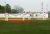 Union players get Fesmire Field ready for play. - Photo by Steven Aldridge