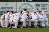 Union players kneel for prayer prior to the start of their games. - Photo by Steven Aldridge