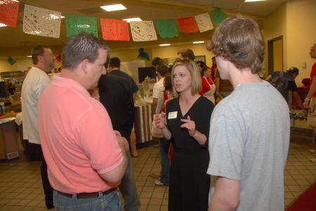 Senior Music Major Katie McCoy speaks to a prospective student and his parent during a preview day.
