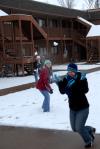 Ruthann Pike ducks and runs as her friends Renee Roberson and Sarah Nadaskay throw snowballs at her on a snowday. - Photo by Morris Abernathy
