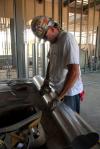 A man works on the complex HVAC system in White Hall. - Photo by Morris Abernathy