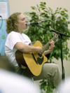 Freshman Amanda Larson entertains the crowd at the Open Mic concert during New Student Orientation.
 - Photo by Justin Veneman