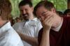 Junior Journalism Major Tyler Whetstone and Web Development Agent Cam Tracy enjoy a joke told at the Communication Arts Awards. - Photo by Beth Spain