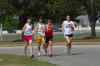Charley Moss, Jill Konkol, Candace Cross and Lydia Bond run on campus during cross country practice. - Photo by Morris Abernathy