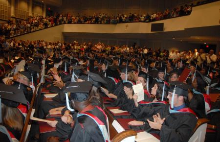 Friends and families give the graduates a standing ovation for their hard work at the end of the August graduation ceremony.