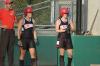 Amy Chatham (left) and Michelle Albonetti (right) watch the pitcher prior to their at bat.  Assistant Coach Steven Gream watches as well. - Photo by Steven Aldridge
