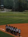 Union players gather down the third base line in preparation for the playing of the National Anthem. - Photo by Steven Aldridge