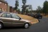 Cars lined up on the newly paved utility road behind McAfee Residence Complex as friends and families helped new students move into their dorms. - Photo by Stephanie Schroeder