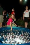 Senior Learning Foundations Major Carolyn Negley grabs a soda from the cooler at the Howdy Party. - Photo by Neisha Fuson
