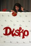 Esperanza Aguilar drops a disk as she tries to win a prize playing Disko during the SAC game show.  - Photo by Stephanie Schroeder