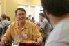 Troy Riggs, mathematics department chair, talks with an MK Isaac Evans during the Dinner with your Department event at New Student Orientation. - Photo by Stephanie Schroeder