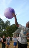 Once the big purple ball was brought out, students had a blast playing in a circle trying to keep it up in the air as long as possible without hitting the ground during the annual ice cream social at President Dockery's house. - Photo by Stephanie Schroeder