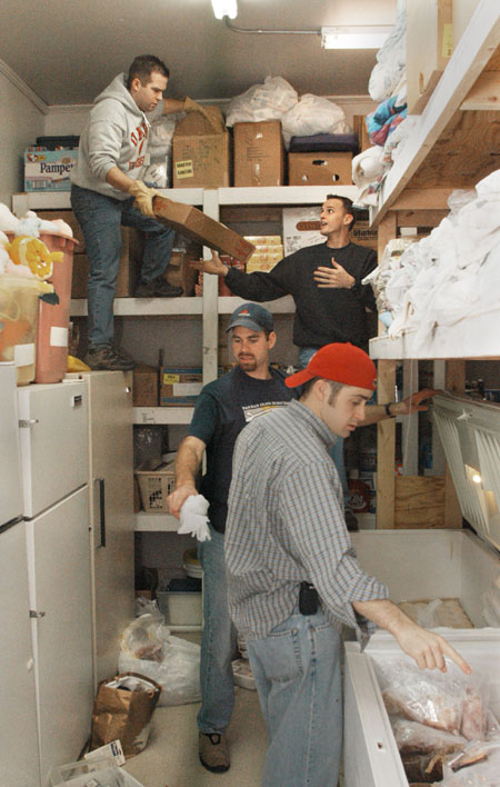 Union staff members team up to clean and organize the food pantry at The Care Center during Martin Luther King Jr. service day.  Pictured in the background are Mark VanderHaar (left) and Ben Mandrell and in the foreground are Bobby Ludwig (left) and Jay Ridenour.
