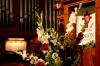Flowers were placed on stage to honor Kyle L. Hathcox during his memorial service. - Photo by Stephanie Schroeder