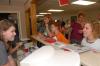 Hurt Residence Assistant Suzanne Short checks in freshmen as they arrive to move into their dorm room. - Photo by Kathleen Murray
