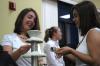 The chocolate fountains were a big hit for both students and faculty at the President's Reception. Michelle Pardue takes the opportunity to try a treat dipped in white chocolate.  - Photo by Neisha Fuson