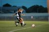 Sophomore Nursing Major Brooke Walker battles with a Bethel opponent for possession of the ball. - Photo by Matt Elia