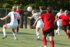 Caitlin Clinger heads the ball as teammate Sam Gase reacts to the ball and Nikki Burau follows behind. - Photo by Steven Aldridge