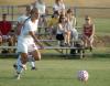 Amberly Armstrong dribbles the ball as Alicia Bennett watches the play. - Photo by Steven Aldridge