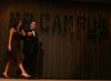 Sophomore Scott McSwain is accompanied by an escort as he shows off his evening wear during Mr. Campus. - Photo by Stephanie Schroeder