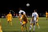 Senior Benny Crozier goes for a header as teammate Franki Mocellin watches. - Photo by Matt Elia