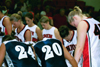 Players and cheerleaders from Union and Lambuth gather at mid-court for a post-game prayer. - Photo by Jim Veneman