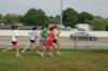 The women's cross country team warms up with their coach Gary Johnson before a meet held on Union's campus.  - Photo by Neisha Fuson