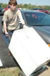 Freshman Austin Camp pushes his refrigerator toward his new dorm room in the Watters Residential complex on move-in day. - Photo by Matthew Diggs