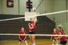 Freshman Jill Dake tips the volleyball over the net in the game against Mid-Continent University.  - Photo by Neisha Fuson