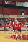In a game against Mid-Continent University, Junior Jennifer Martins (11) bumps the ball over the net.  - Photo by Neisha Fuson