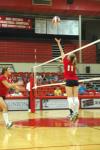 Junior Jennifer Martins sets the ball for Freshman Jill Dake in a game against Mid-Continent University. - Photo by Neisha Fuson