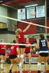 Junior CJ Neathamer taps the volleyball back over to Mid-Continent University.  - Photo by Neisha Fuson