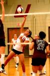 Freshman Jill Dake dinks the ball toward the FHU defenders. - Photo by Matt Elia