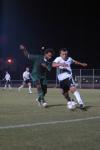 Freshman Franki Mocellin shields off the defender as he attempts to keep possession of the ball. - Photo by Neisha Fuson