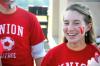 Junior Kasey Cobb, sociology & family studies major, joins together with other fans to cheer on Union soccer players.

 - Photo by Matthew Diggs