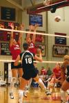 Juniors Emilie Ogas and Brisa Berlin block a hit by Lambuth University. - Photo by Stephanie Schroeder