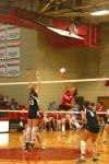 Junior Tiven Catrett hits the ball over the net past a Lambuth blocker. - Photo by Stephanie Schroeder