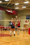 Junior CJ Neathamer and Freshman Jill Dake block a ball hit by a Lambuth player in Union's victory. - Photo by Stephanie Schroeder