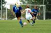 Sophomore Brooke Walker dribbles past two defenders before an attempted shot on goal. - Photo by Matt Elia
