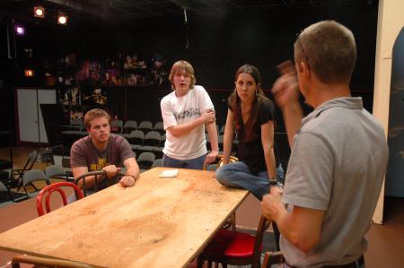 The cast of <em>The Dining Room</em> listens intently as the Director Chris Bennett provides some ideas for a scene. 
